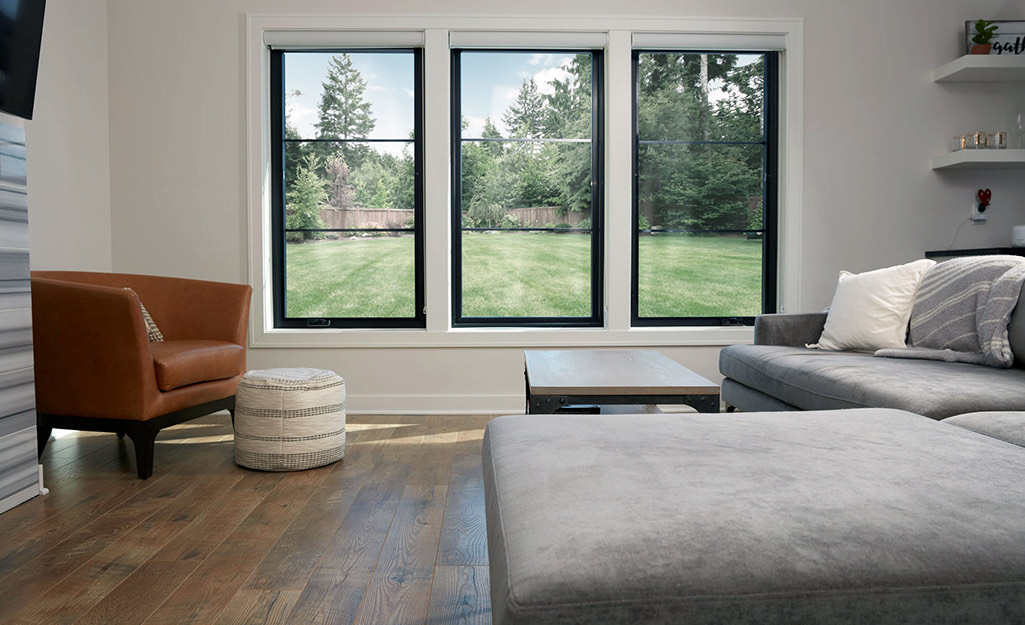 Bright living room with new energy-efficient replacement windows